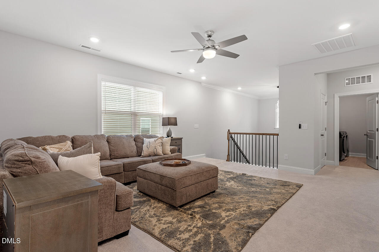 3932 Mount Moran Road Raleigh, NC 27616 - Photo 31 of 40 a living room with furniture and a rug
