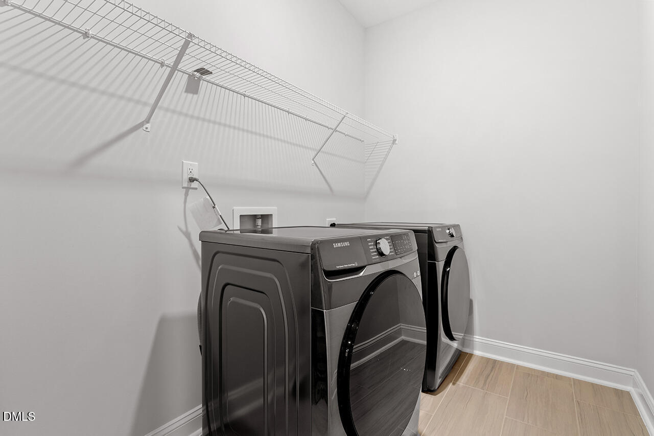 3932 Mount Moran Road Raleigh, NC 27616 - Photo 34 of 40 a utility room with dryer and washer
