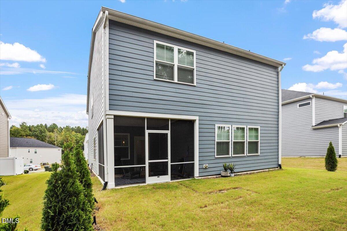 3932 Mount Moran Road Raleigh, NC 27616 - Photo 37 of 40 a view of a house with a yard and potted plants