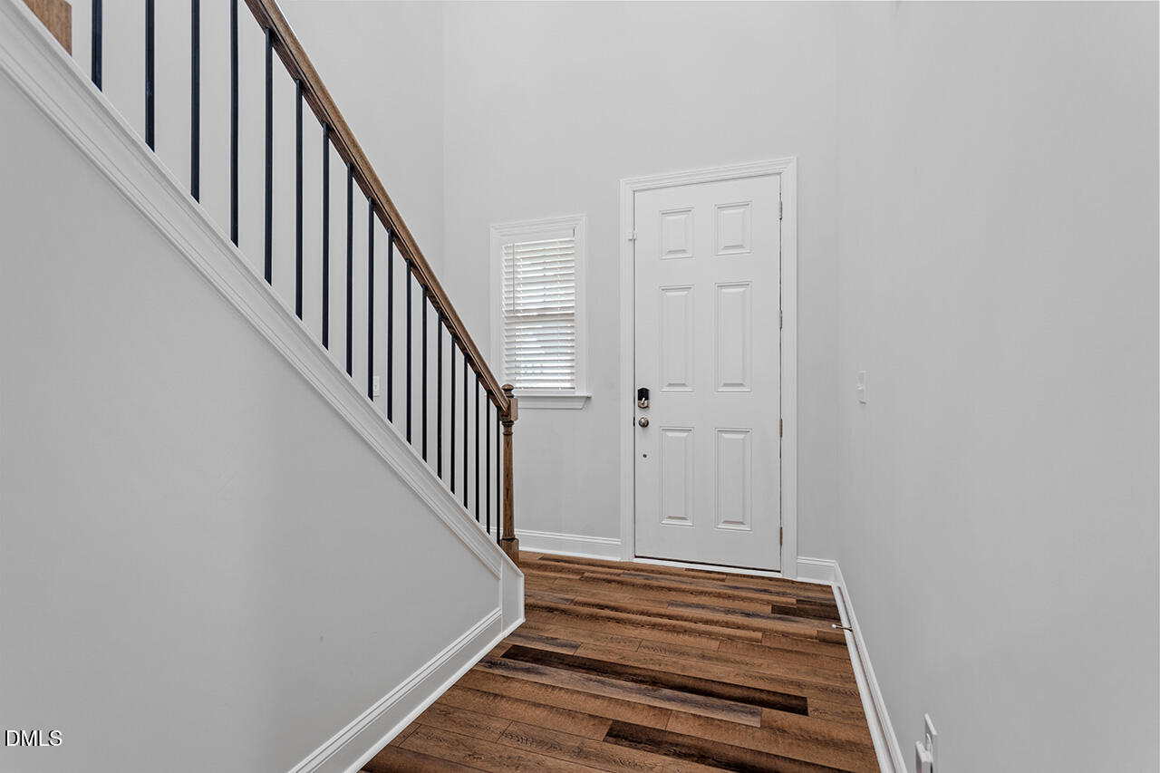 3932 Mount Moran Road Raleigh, NC 27616 - Photo 6 of 40 a view of a hallway with staircase