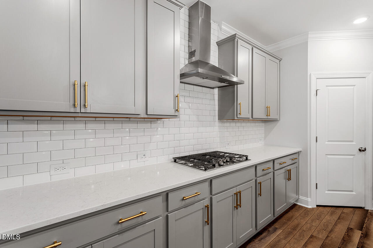 3932 Mount Moran Road Raleigh, NC 27616 - Photo 9 of 40 a kitchen with stainless steel appliances a cabinets and a stove top oven