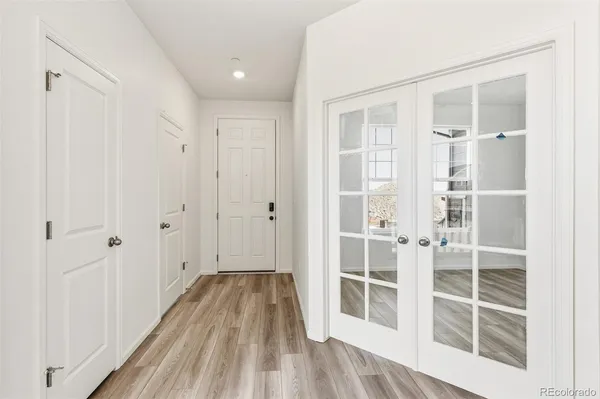 a view of wooden floor and entryway