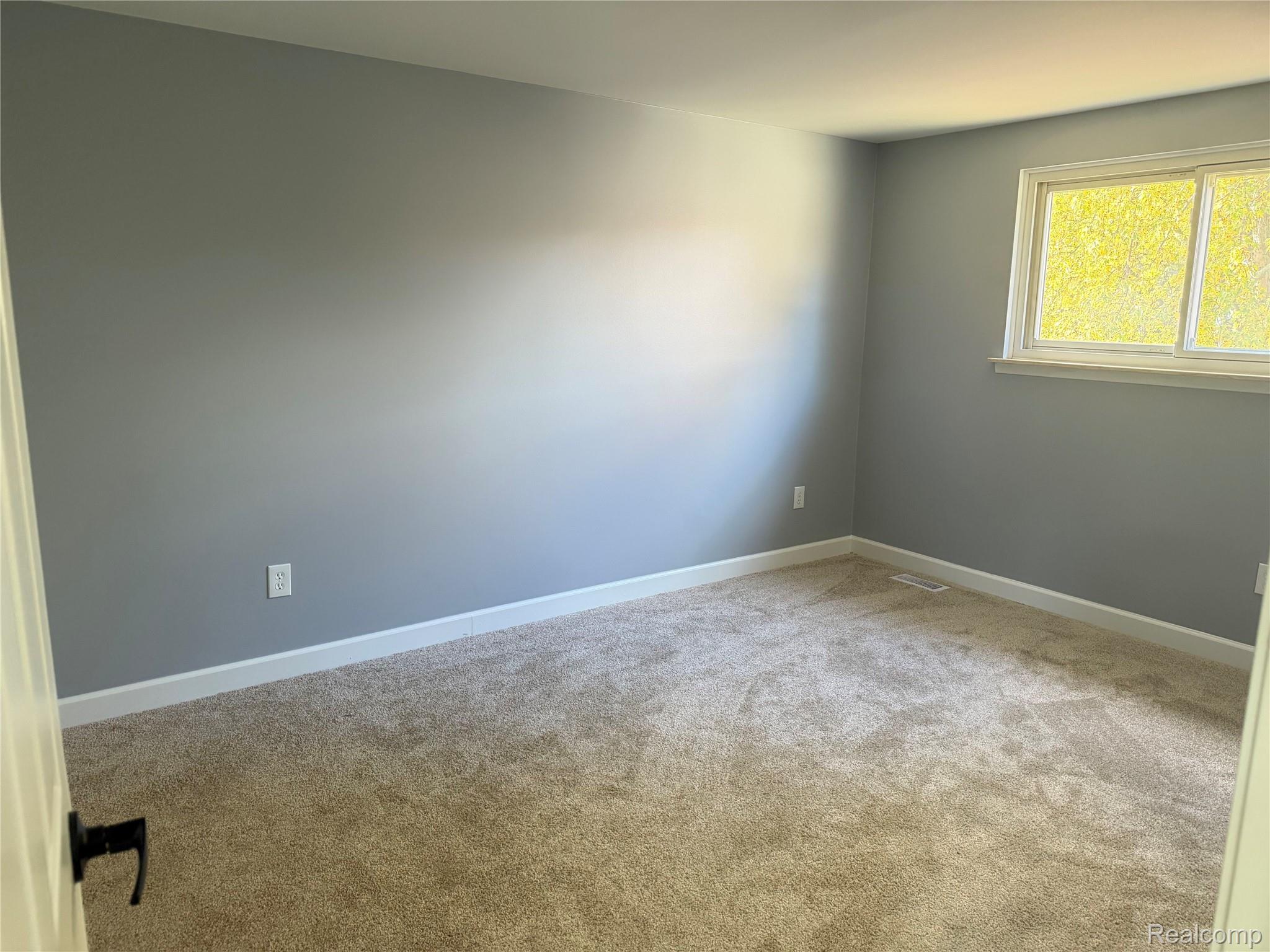 20698 Coachwood Road Riverview, MI 48193 - Photo 29 of 37 Unfurnished room with light carpet and baseboards