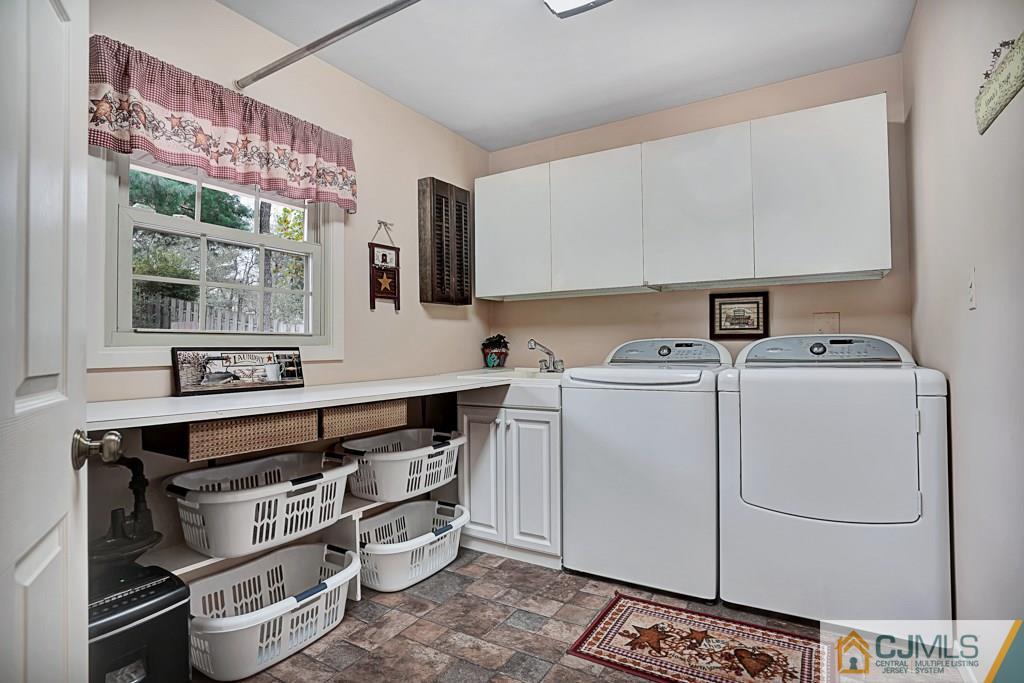 10 Overbrook Road Somerset, NJ 08873 - Photo 14 of 26 a view of cabinets and washer dryer