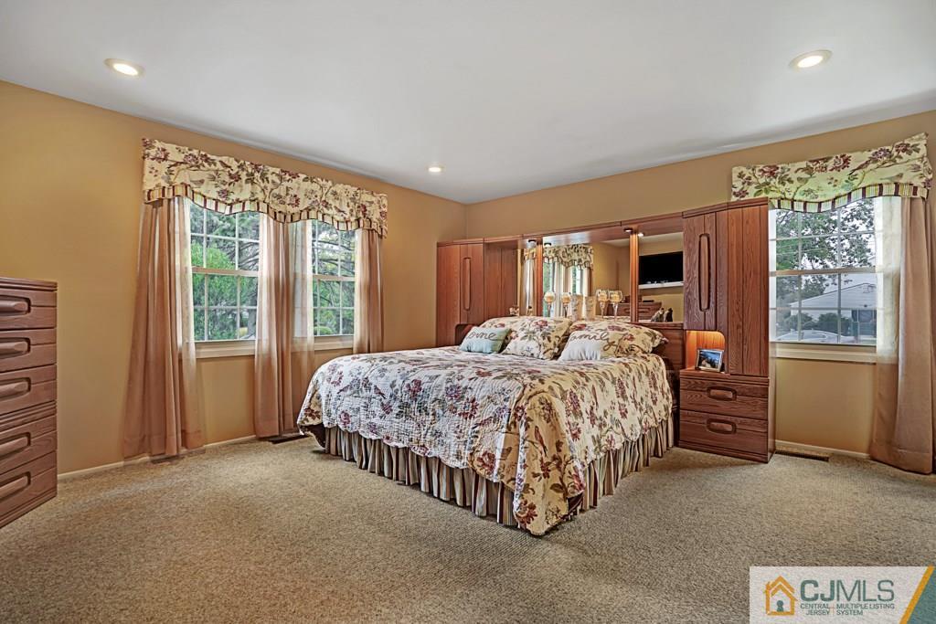 10 Overbrook Road Somerset, NJ 08873 - Photo 15 of 26 a bed room with a bed and a large window