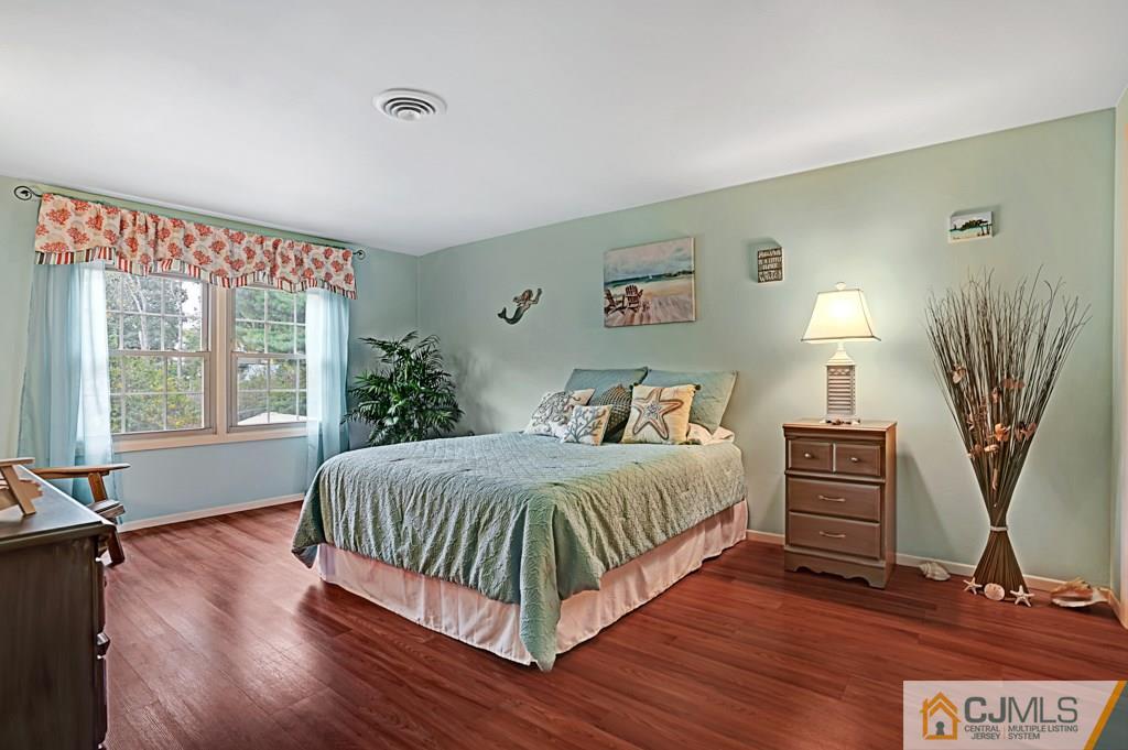 10 Overbrook Road Somerset, NJ 08873 - Photo 17 of 26 a bedroom with a bed and wooden floor