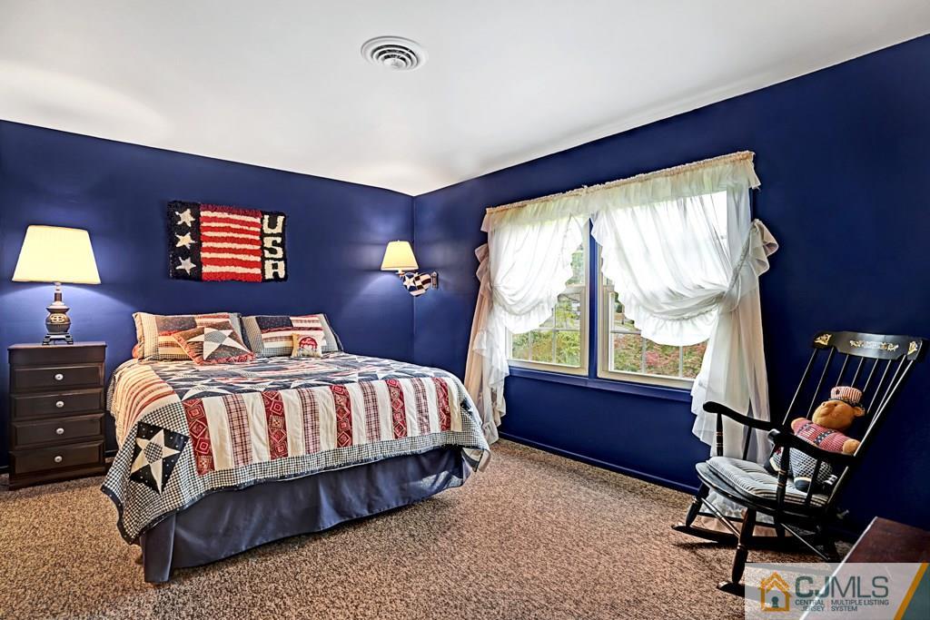 10 Overbrook Road Somerset, NJ 08873 - Photo 18 of 26 a bedroom with a bed and a large window