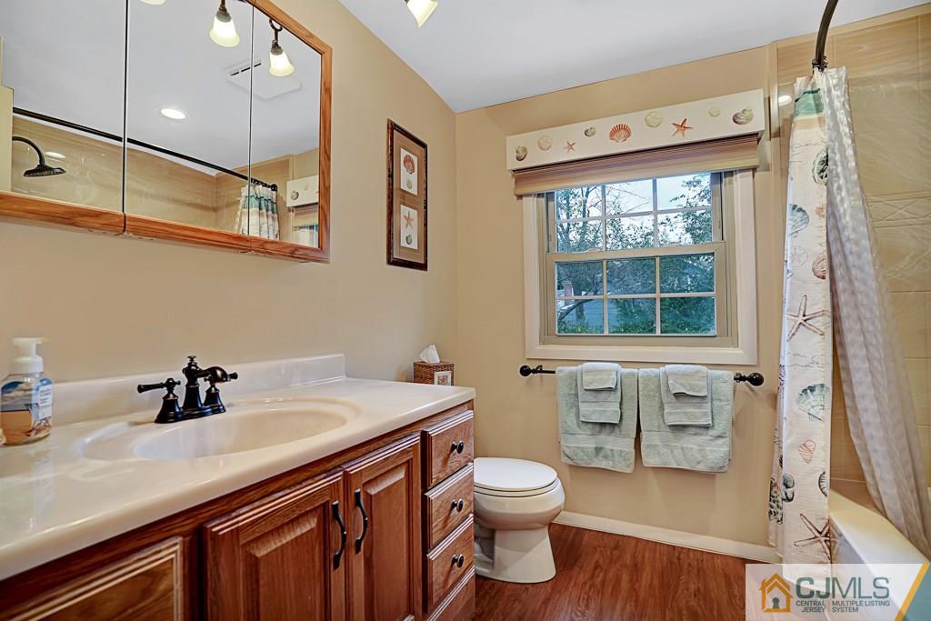 10 Overbrook Road Somerset, NJ 08873 - Photo 20 of 26 a bathroom with a sink a toilet and shower
