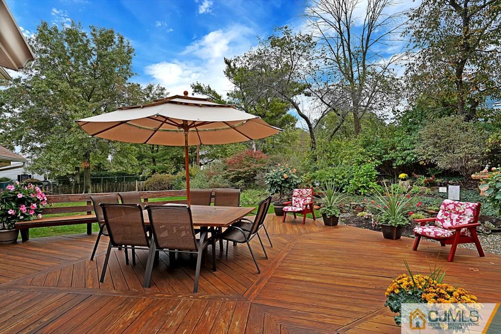 10 Overbrook Road Somerset, NJ 08873 - Photo 25 of 26 a view of a outdoor sitting area with furniture and wooden floor