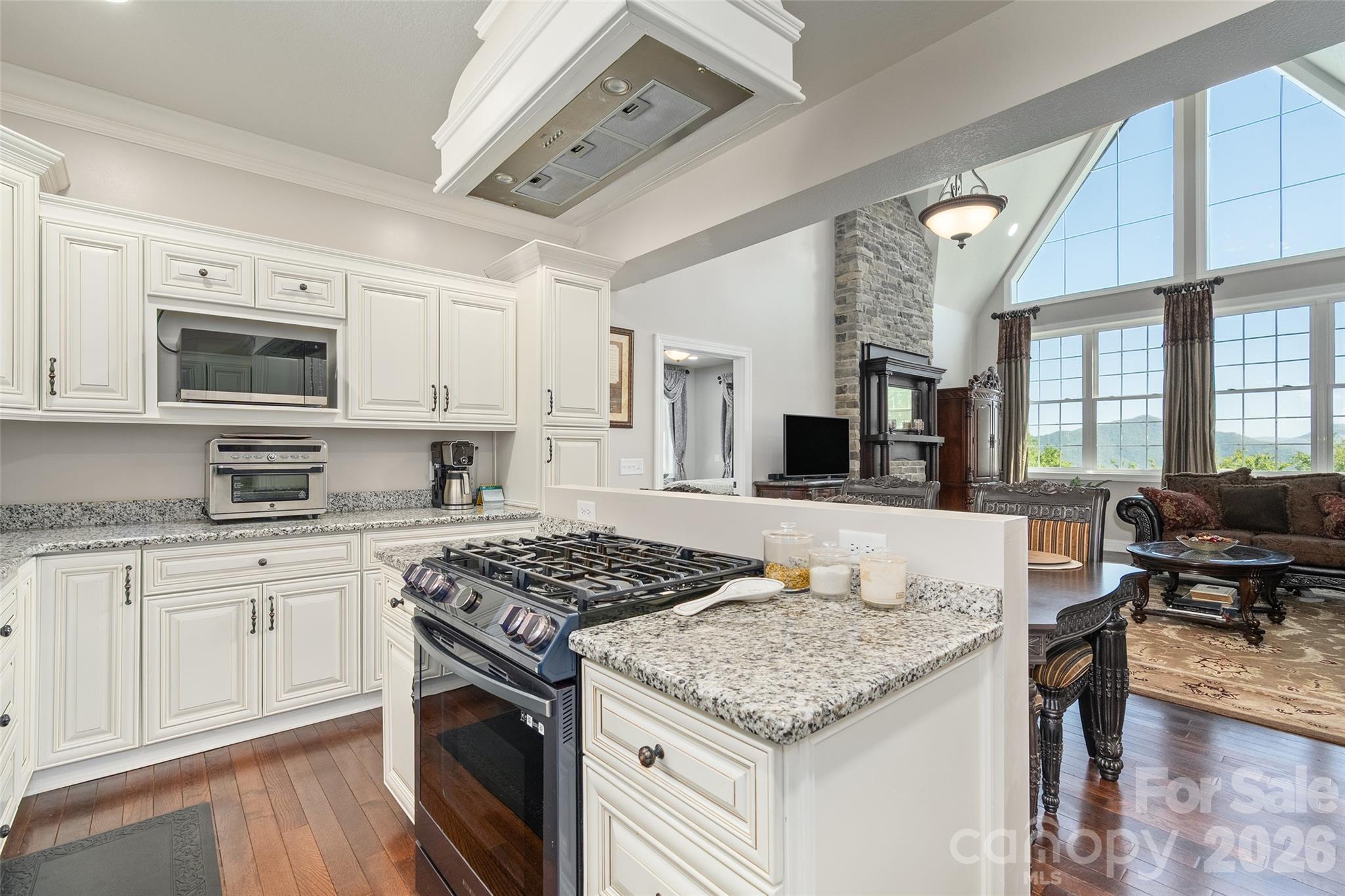 114 Nesting Ridge Waynesville, NC 28785 - Photo 11 of 40 a kitchen with stainless steel appliances granite countertop a stove and a sink