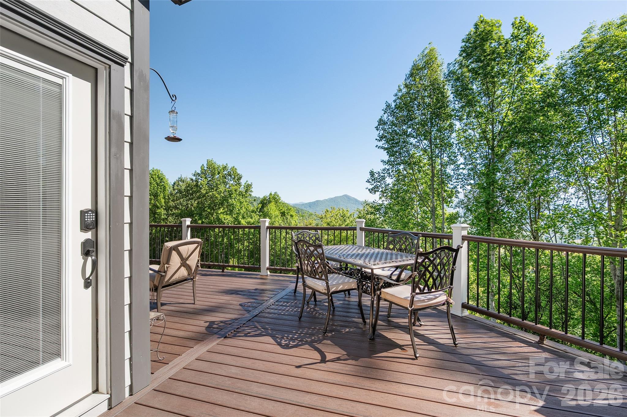 114 Nesting Ridge Waynesville, NC 28785 - Photo 15 of 40 a balcony with wooden floor table and chairs