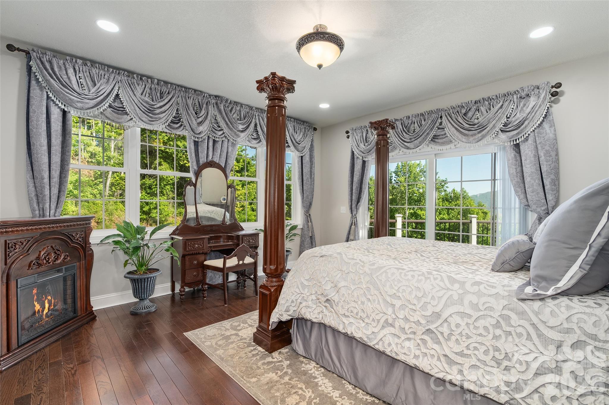 114 Nesting Ridge Waynesville, NC 28785 - Photo 16 of 40 a bedroom with a bed and wooden floor