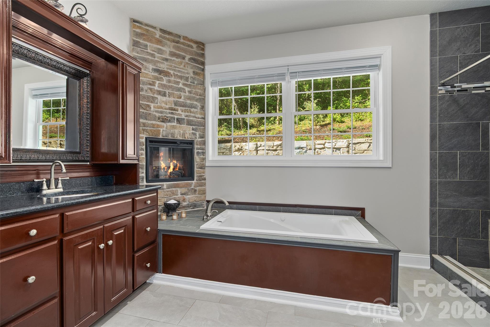 114 Nesting Ridge Waynesville, NC 28785 - Photo 19 of 40 a spacious bathroom with a tub sink and mirror