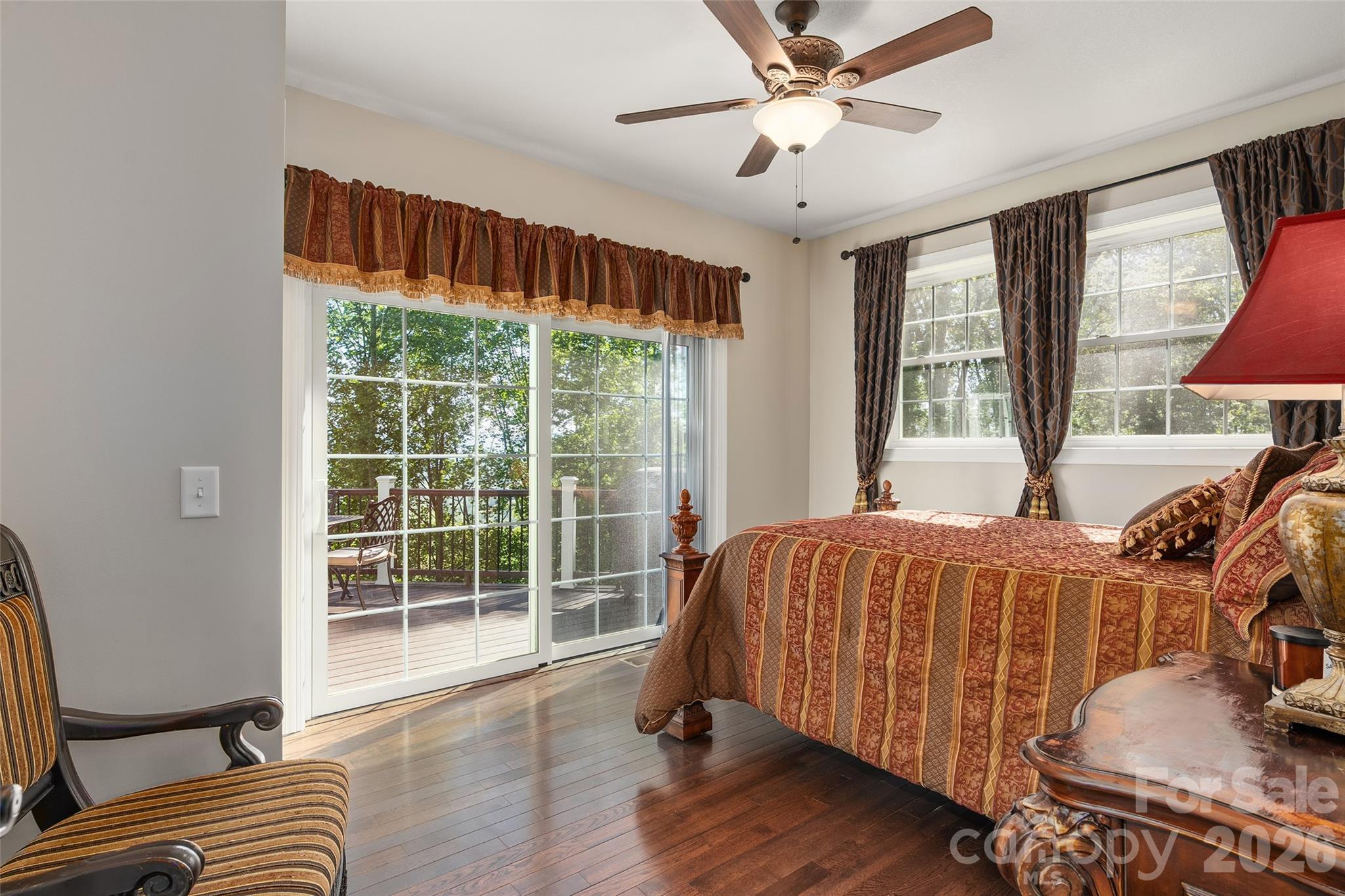 114 Nesting Ridge Waynesville, NC 28785 - Photo 22 of 40 a bedroom with a bed and wooden floor