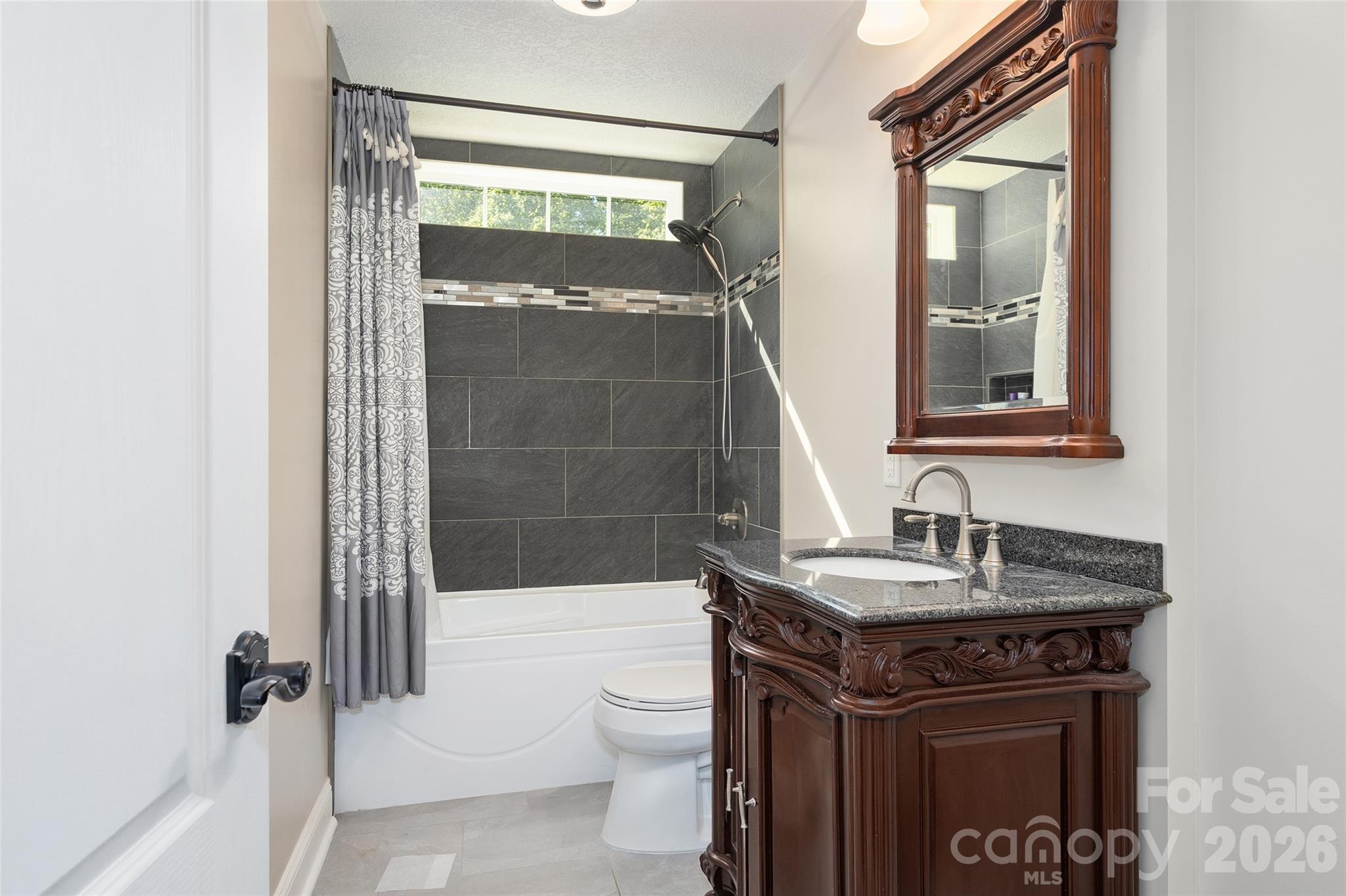 114 Nesting Ridge Waynesville, NC 28785 - Photo 23 of 40 a bathroom with a sink a toilet and shower