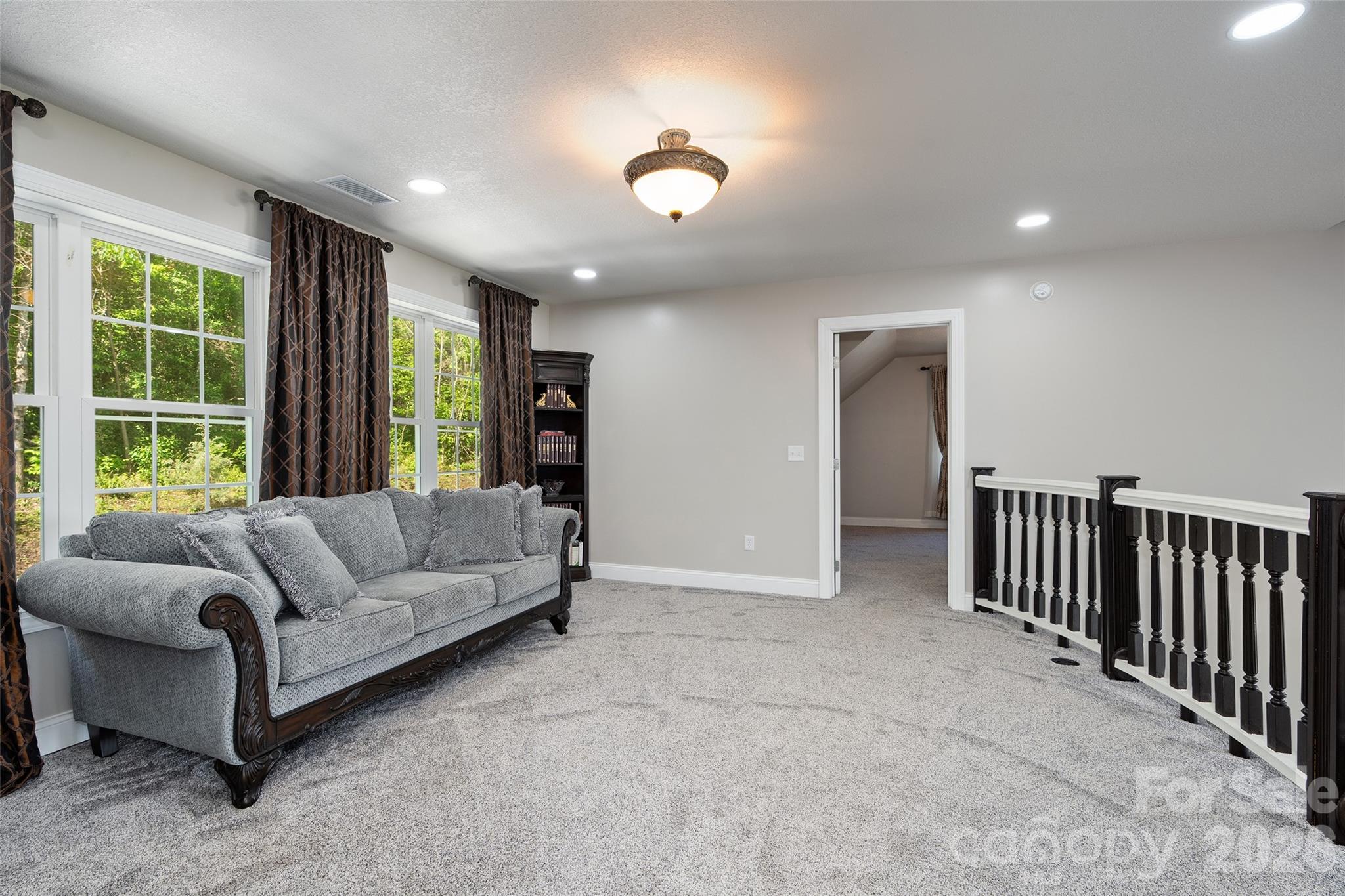 114 Nesting Ridge Waynesville, NC 28785 - Photo 25 of 40 a living room with furniture and a large window