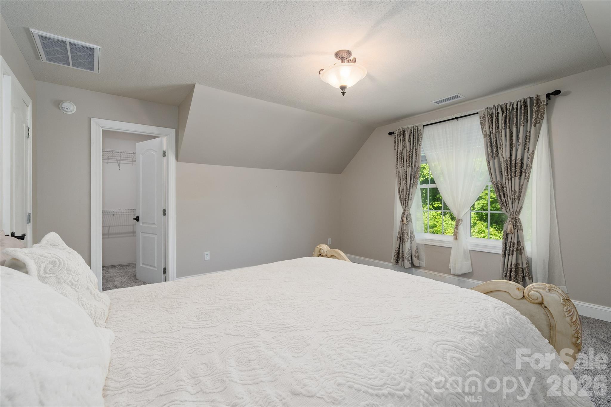 114 Nesting Ridge Waynesville, NC 28785 - Photo 27 of 40 a bedroom with a bed and a large window