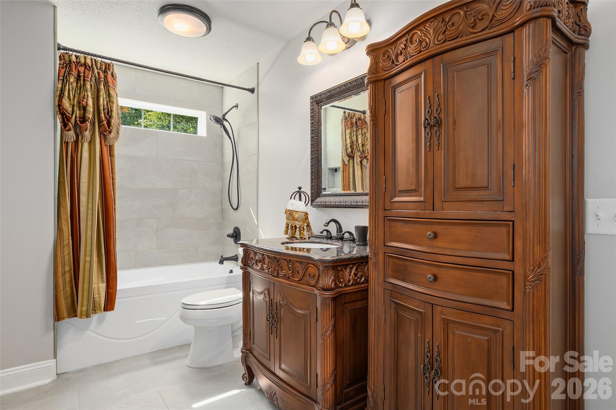 114 Nesting Ridge Waynesville, NC 28785 - Photo 28 of 40 a bathroom with a granite countertop sink toilet and shower