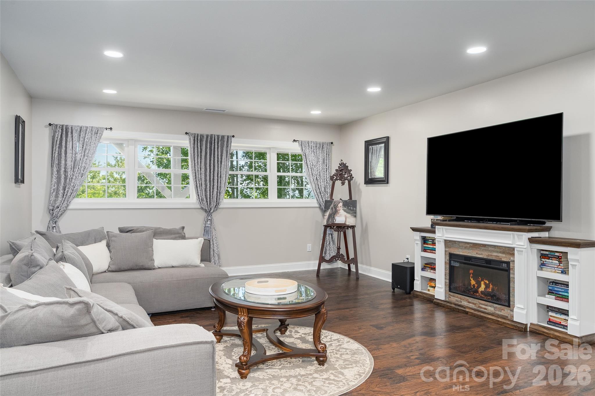 114 Nesting Ridge Waynesville, NC 28785 - Photo 29 of 40 a living room with furniture and a flat screen tv