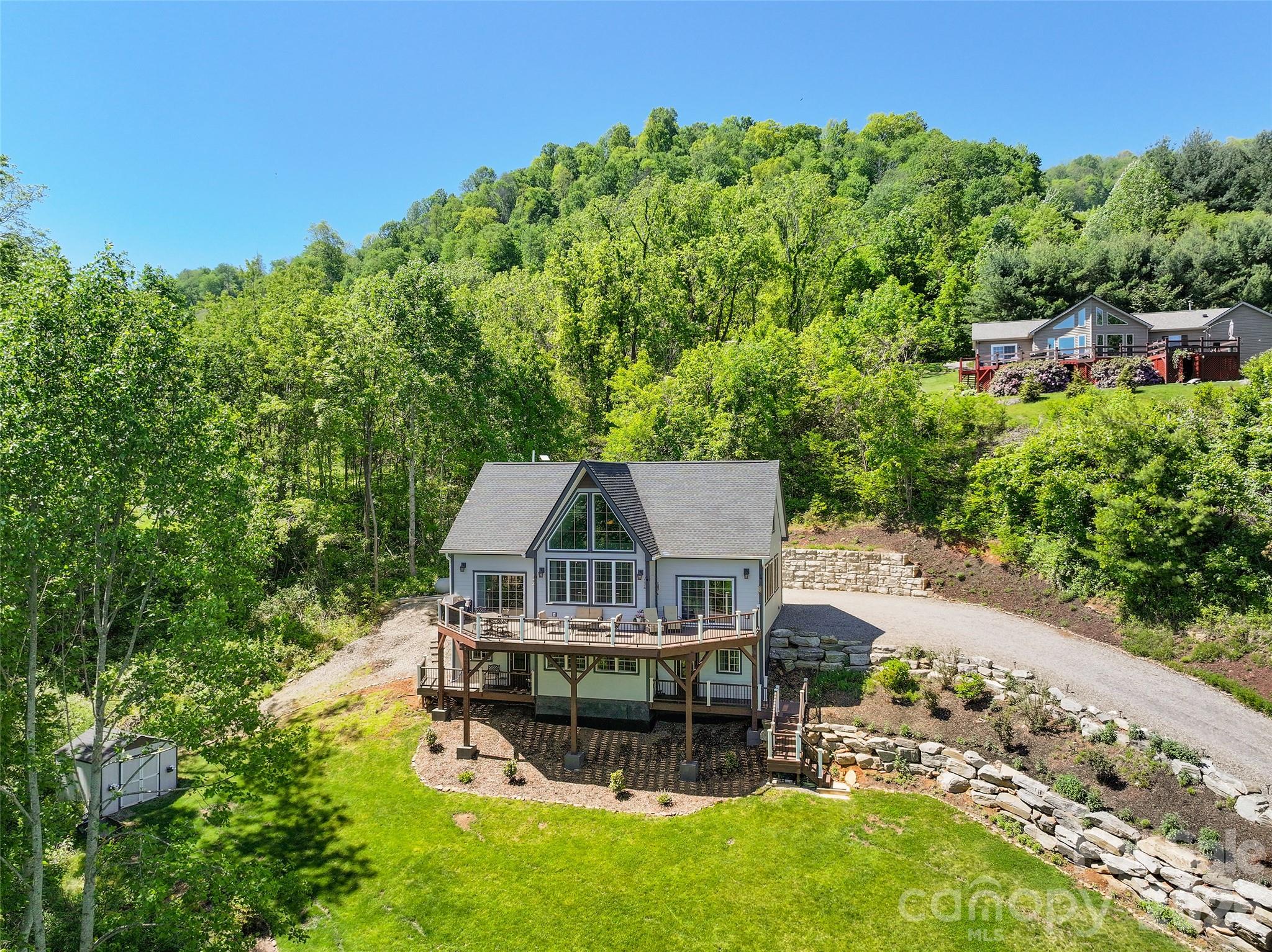 114 Nesting Ridge Waynesville, NC 28785 - Photo 6 of 40 an aerial view of a house with swimming pool garden and patio