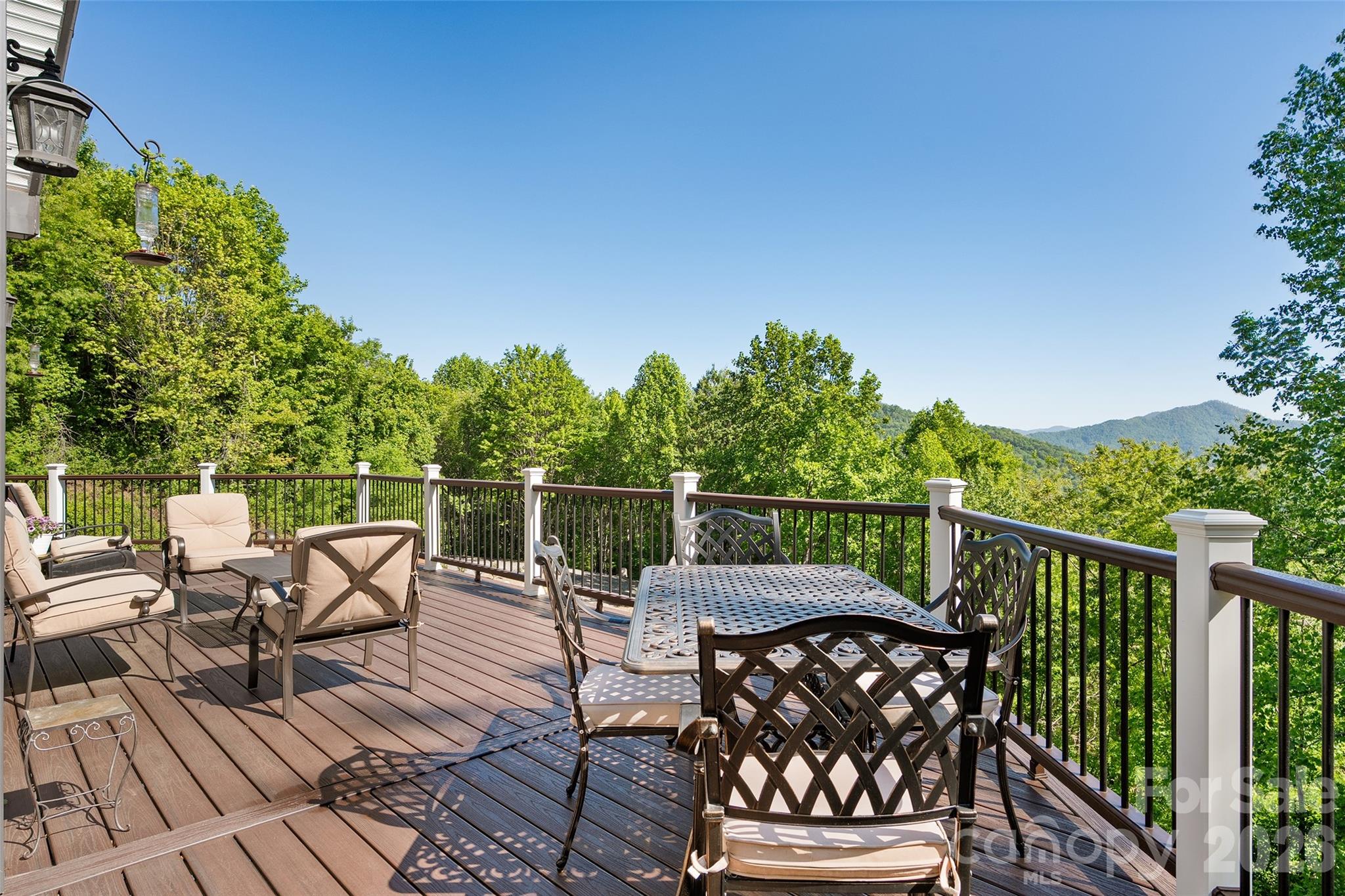 114 Nesting Ridge Waynesville, NC 28785 - Photo 8 of 40 a view of a chairs on wooden deck