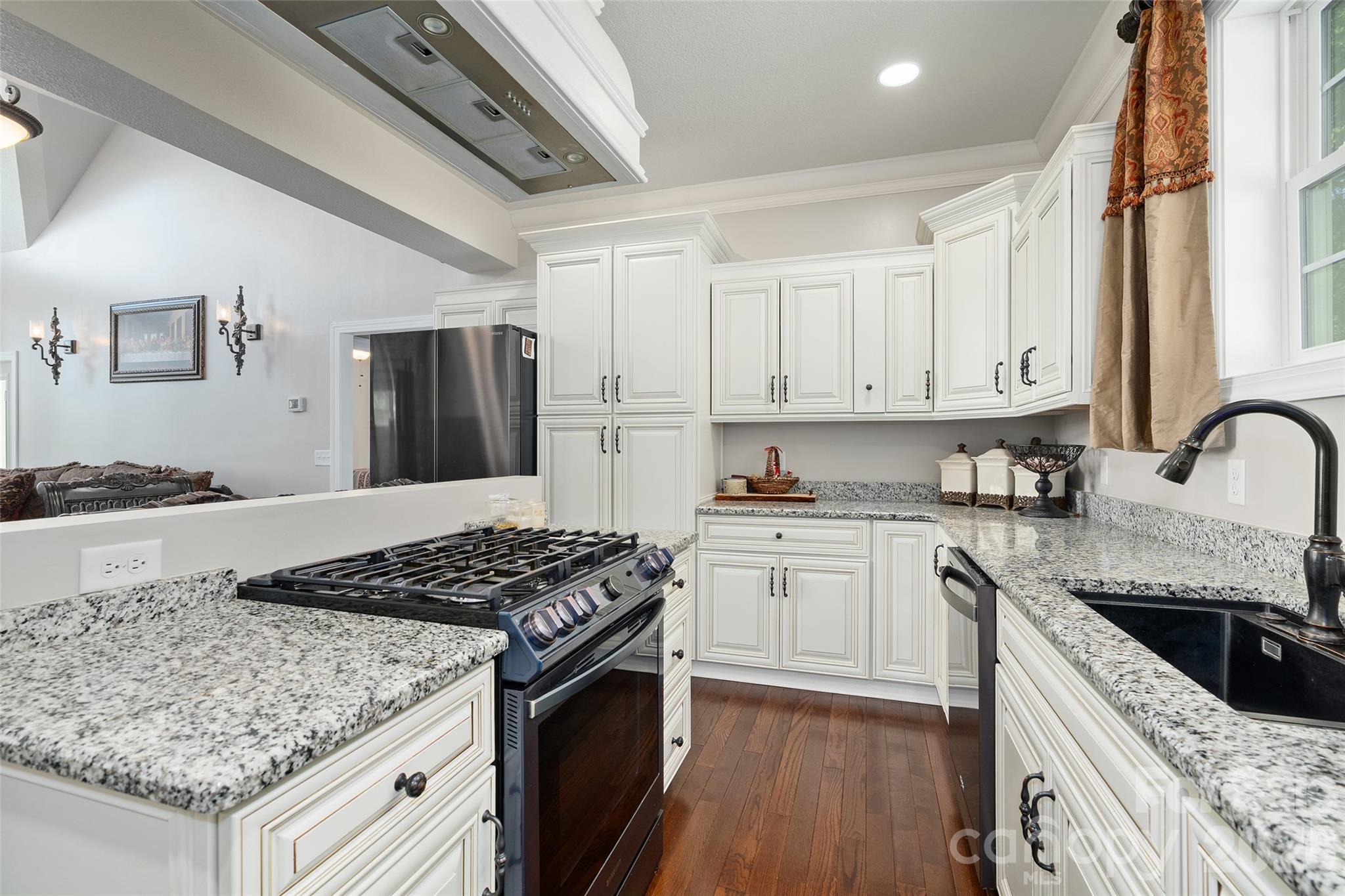 114 Nesting Ridge Waynesville, NC 28785 - Photo 9 of 40 a kitchen with stainless steel appliances granite countertop a stove sink and cabinets