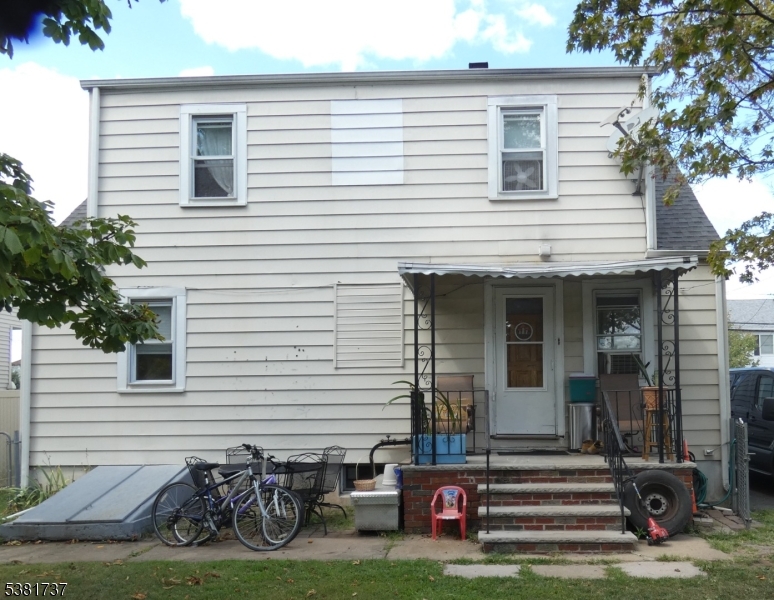 1911 West Camplain Road Manville, NJ 08835 - Photo 2 of 3 a front view of a house with garden