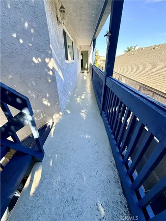 a view of balcony with furniture