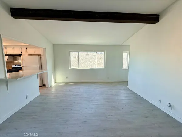 a view of a kitchen with a sink and dishwasher cabinets