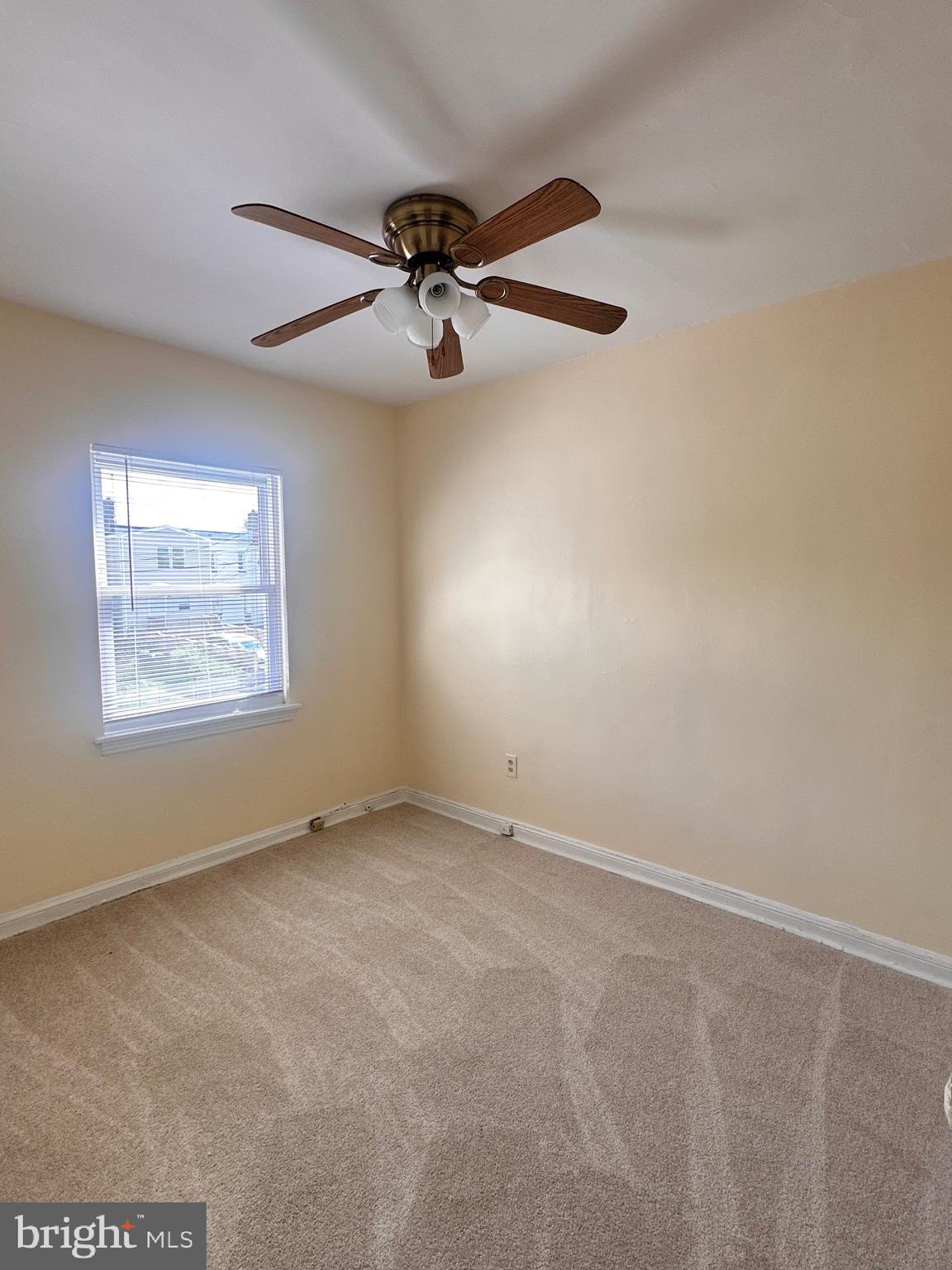 3433 Clay Street Northeast Washington, DC 20019 - Photo 13 of 19 an empty room with windows and fan