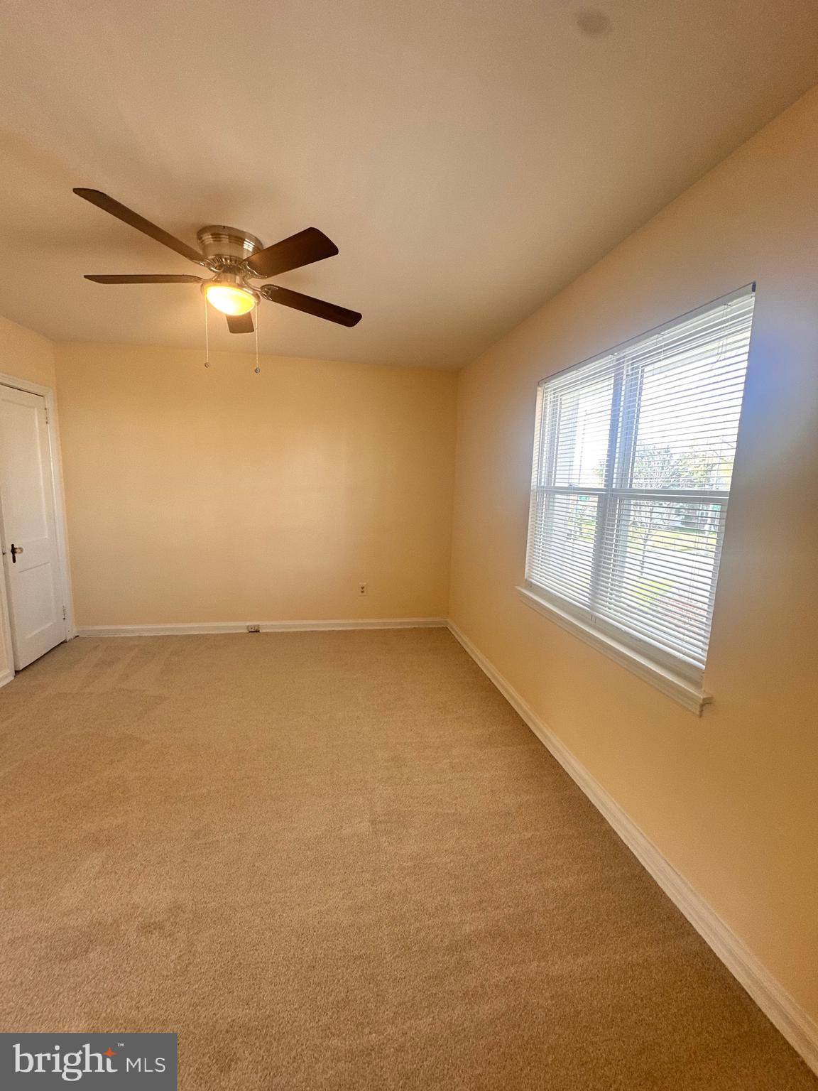 3433 Clay Street Northeast Washington, DC 20019 - Photo 17 of 19 an empty room with windows and fan