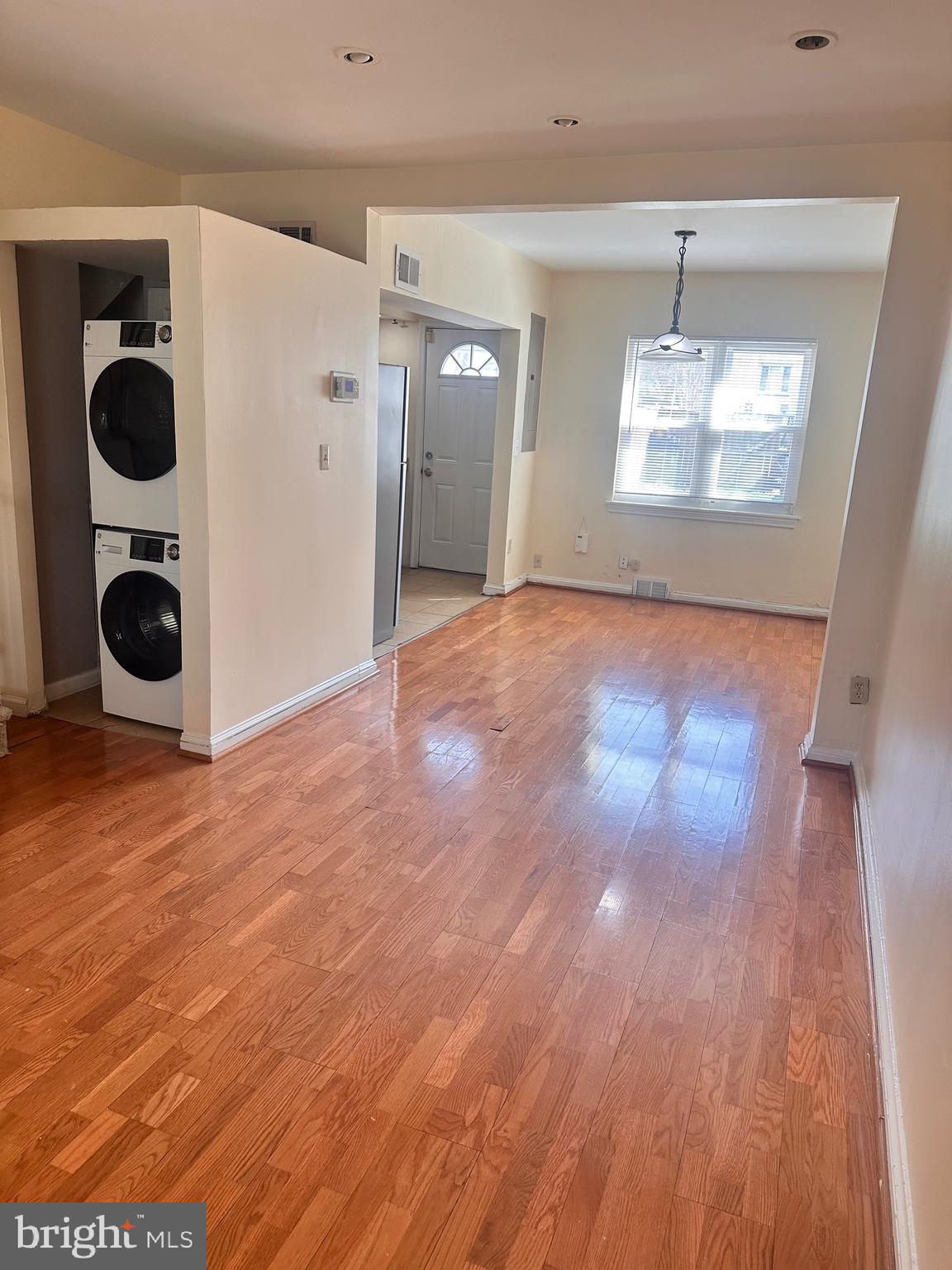 3433 Clay Street Northeast Washington, DC 20019 - Photo 6 of 19 an empty room with wooden floor and windows