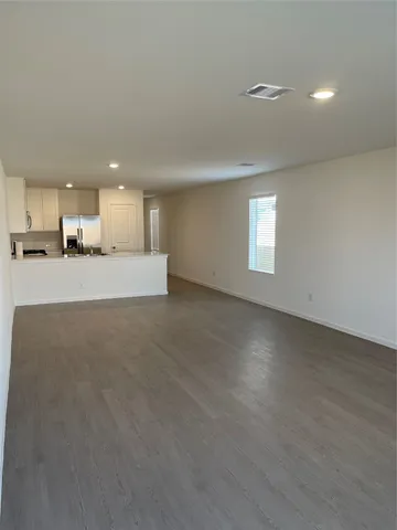 a view of a kitchen with a sink and a window