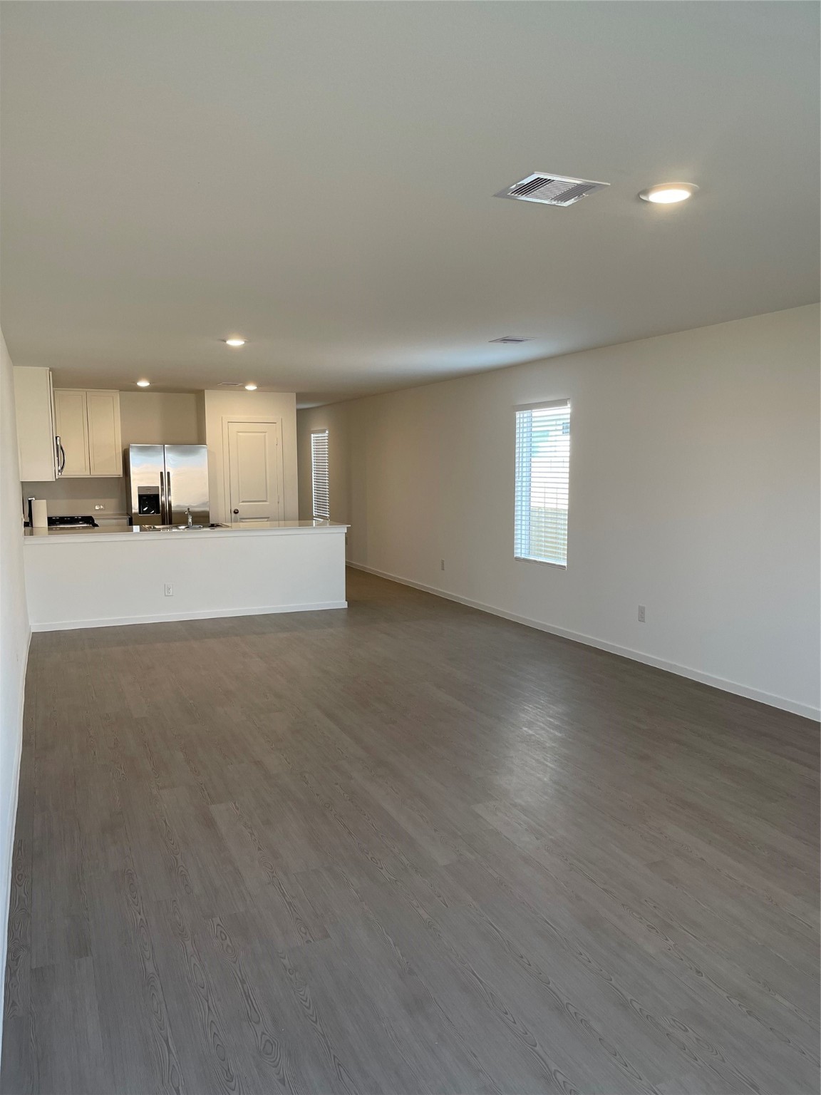 a view of a kitchen with a sink and a window