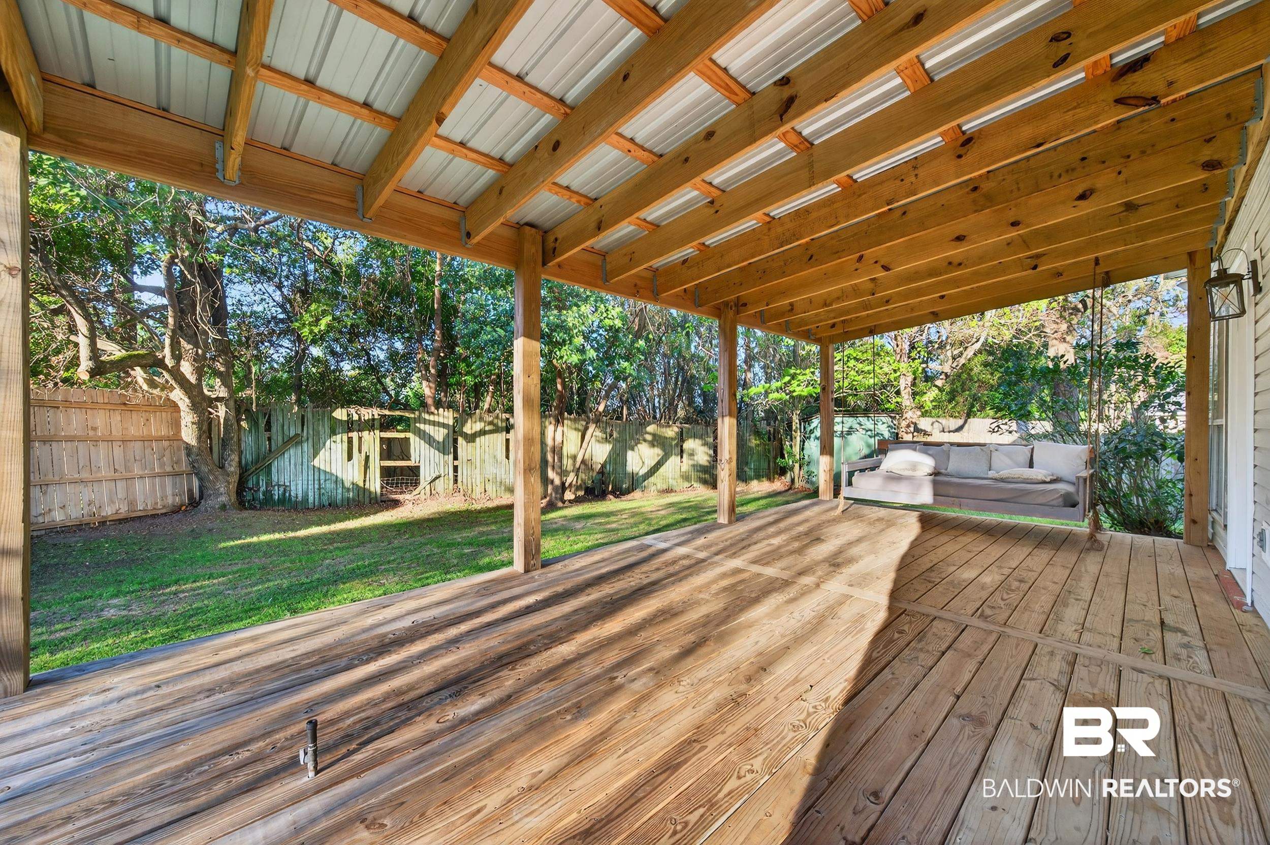 7050 Highpointe Place West Daphne, AL 36527 - Photo 35 of 66 Wooden terrace with a fenced backyard and outdoor lounge area