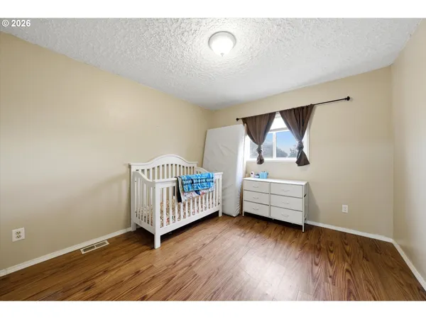 a bedroom with furniture and window