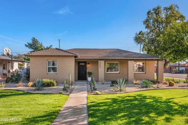 a front view of a house with swimming pool having outdoor seating