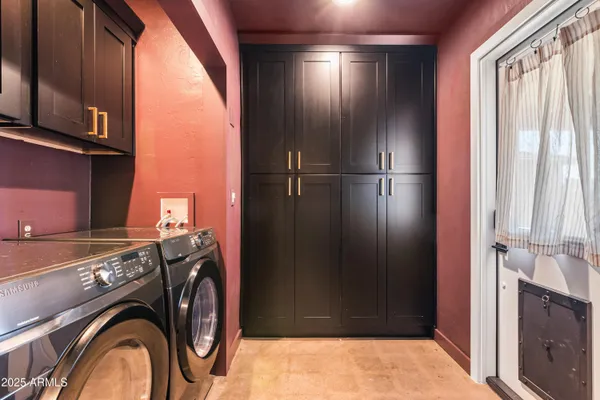 a view of storage and utility room with washer and dryer