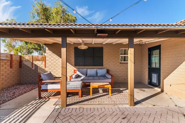 a view of a balcony with two chairs and a table