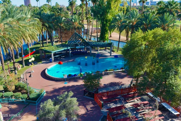 an aerial view of a house with yard swimming pool and outdoor seating