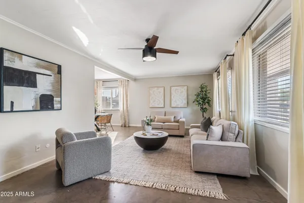 a living room with furniture and a large window