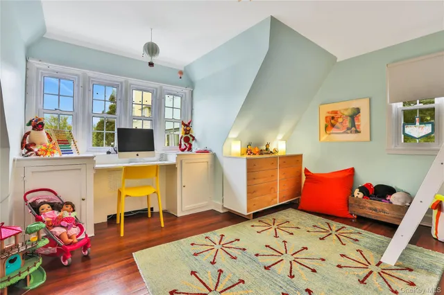a bed room with furniture and wooden floor