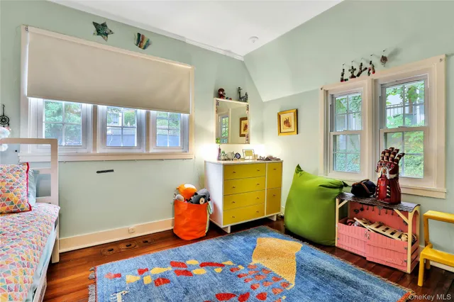 a bed room with furniture and a window