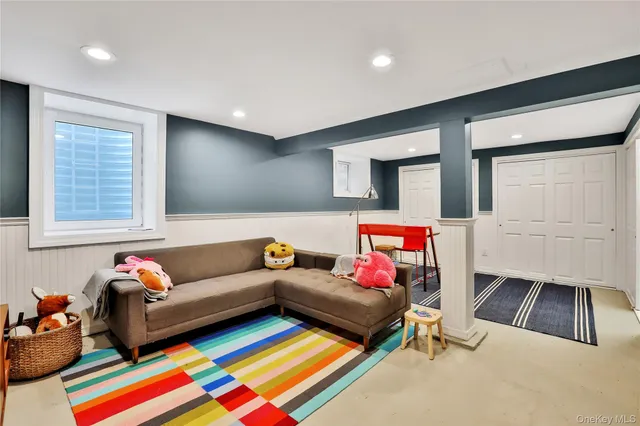a living room with furniture and a rug