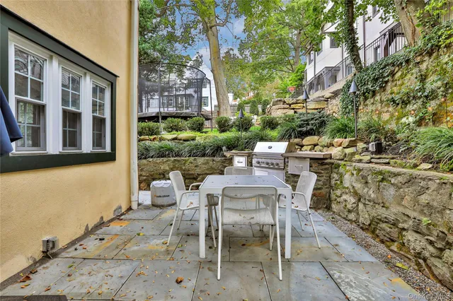 a view of an outdoor space with lounge chair