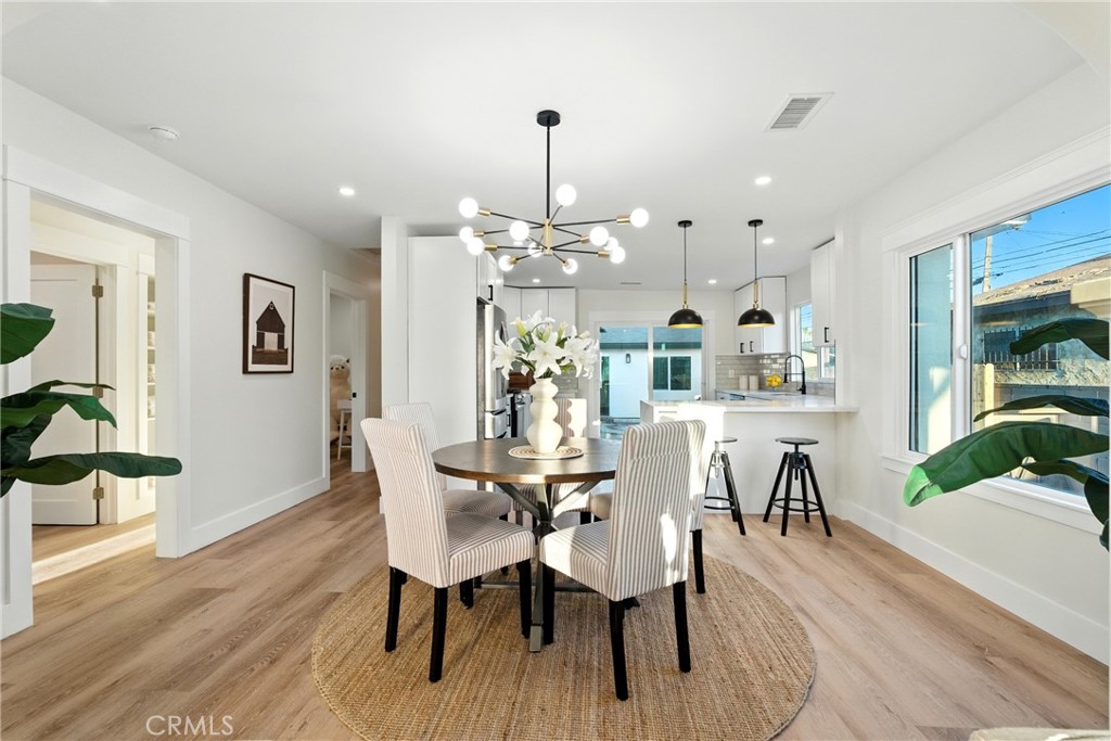 4340 2nd Avenue Los Angeles, CA 90008 - Photo 11 of 51 a view of a dining room with furniture and wooden floor