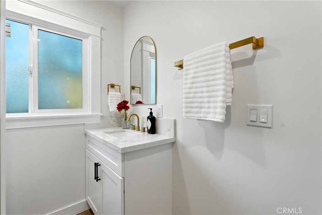 4340 2nd Avenue Los Angeles, CA 90008 - Photo 17 of 51 a bathroom with a sink and a mirror