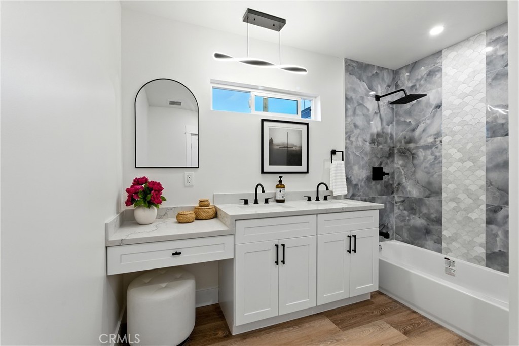 4340 2nd Avenue Los Angeles, CA 90008 - Photo 24 of 51 a bathroom with a sink mirror and a bathtub
