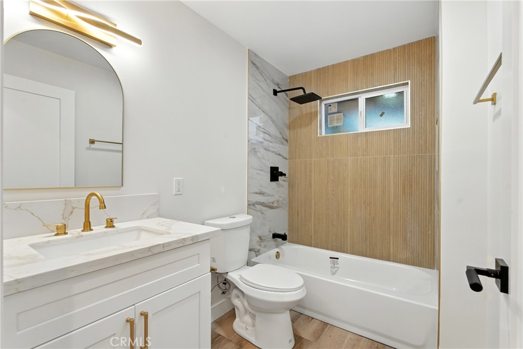 4340 2nd Avenue Los Angeles, CA 90008 - Photo 35 of 51 a bathroom with a sink a toilet and shower