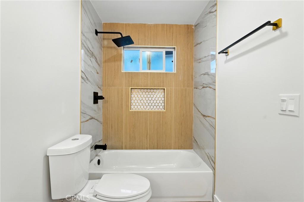 4340 2nd Avenue Los Angeles, CA 90008 - Photo 36 of 51 a bathroom with a toilet and a shower